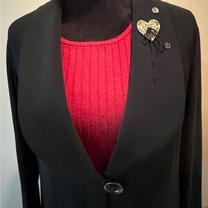 Lightweight jacket top with metal heart.